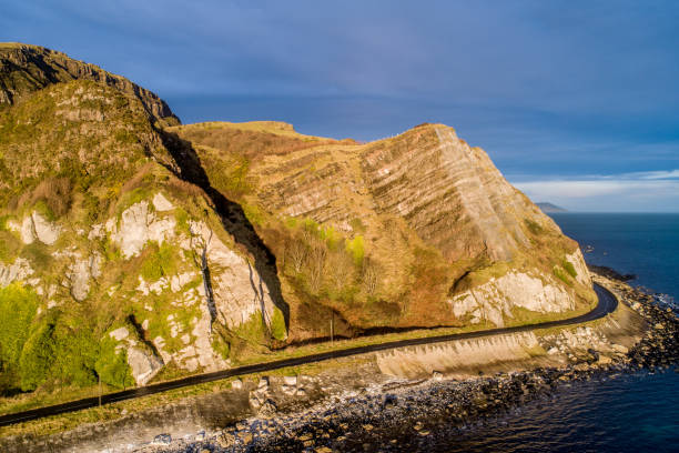 istock Northern Ireland. Atlantic coast, cliffs and coastal road 1219956840