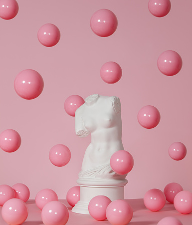 Plaster model of female torso (mass produced replica of Venus de Milo) and pink spheres
