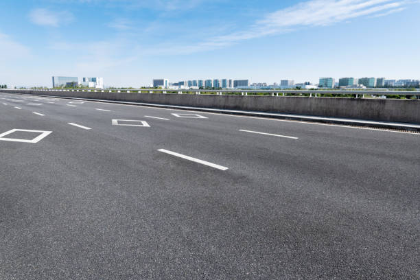 istock Empty asphalt road with buildings in the city 1219957819