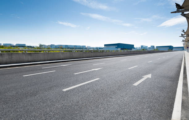 istock Arrow signs on asphalt road 1219957823