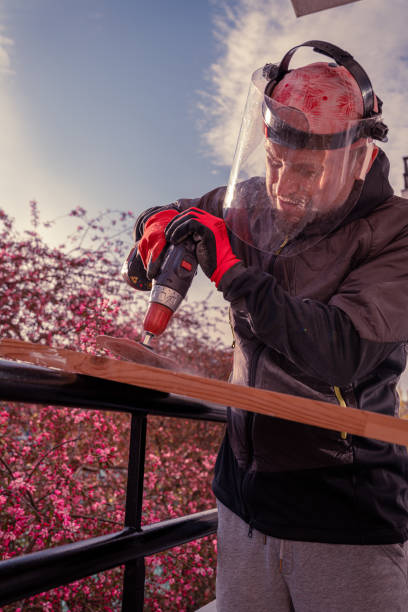 istock DIY project on balcony. Fixing furniture. 1219957898