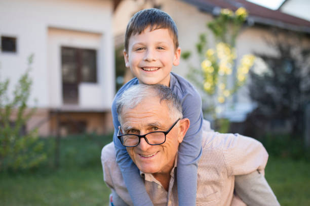 istock Senior man having fun with his small grandson 1219958266
