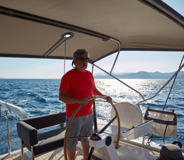 istock Male skipper sailing on yacht. 1219958572