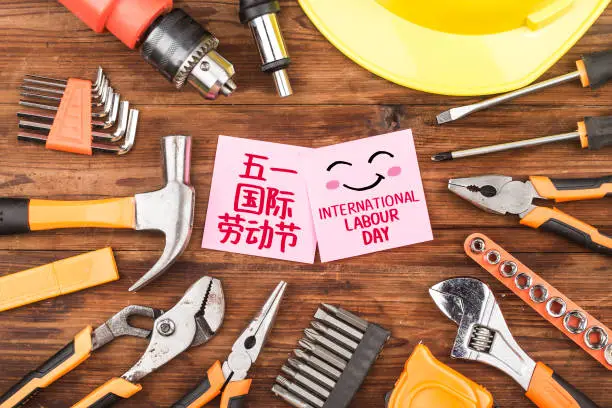 Photo of Concept of International Labor DayRepair equipment and many handy tools.Chinese translation May 1st Labor Day