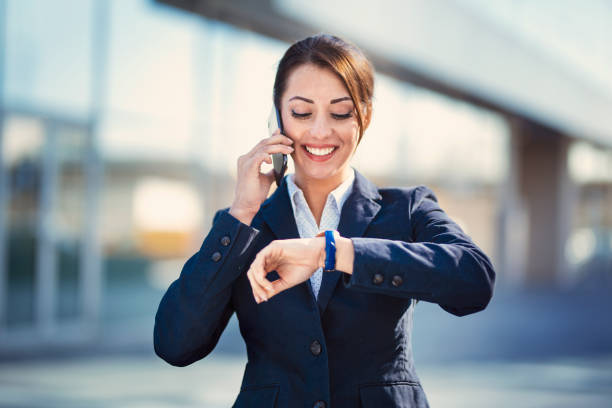 istock Businesswoman checking time on wristwatch 1219959927
