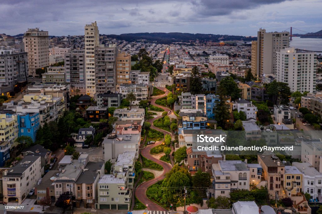 Aerial view of Lombard Street at Sunrise An aerial view of Lombard Street in San Francisco at sunrise. Golden Gate Bridge is visible and Palace of Fine Arts. Lombard Street - San Francisco Stock Photo