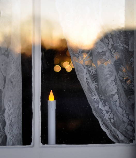 Christmas candle in an historic house window