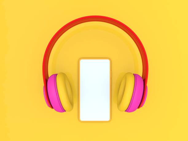 istock Headphones and smartphone mockup on a yellow background. 1219965930