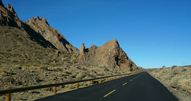 istock Road against clear blue sky 1219965960