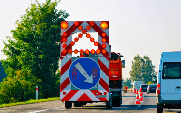 istock Truck carrying arrow down left reflective direction road sign highway 1219966487