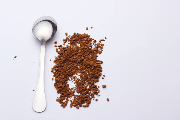 istock Metal spoon with granulated coffee on a white background 1219967789