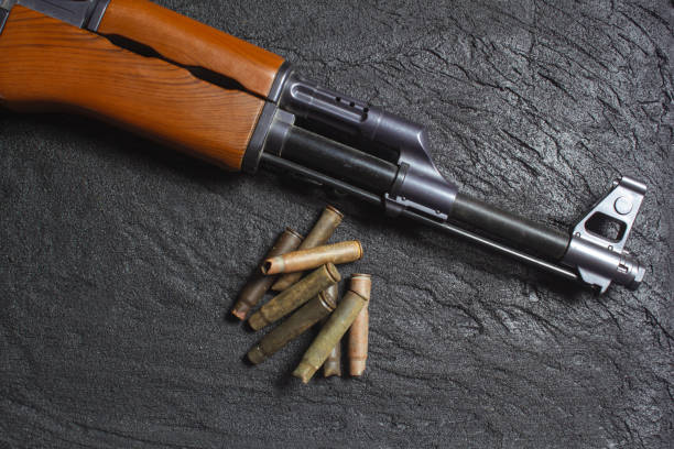 istock old rusty spent cartridges and a gun barrel on black concrete 1219968859