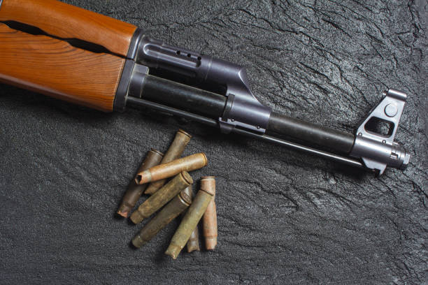 istock old rusty spent cartridges and a gun barrel on black concrete 1219969436