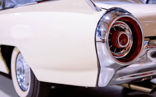 istock Back headlight of white vintage classic car auto 1219970206