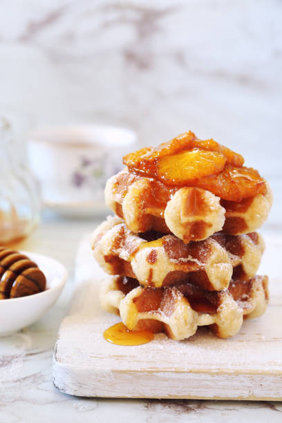 istock belgian waffles with caramelized orange and honey for breakfast 1219970952