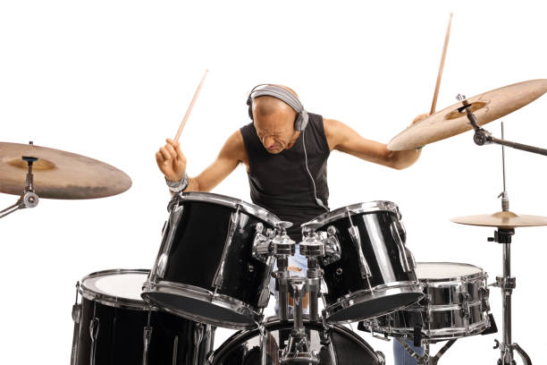 istock Man with headphones playing a drum set 1219970986