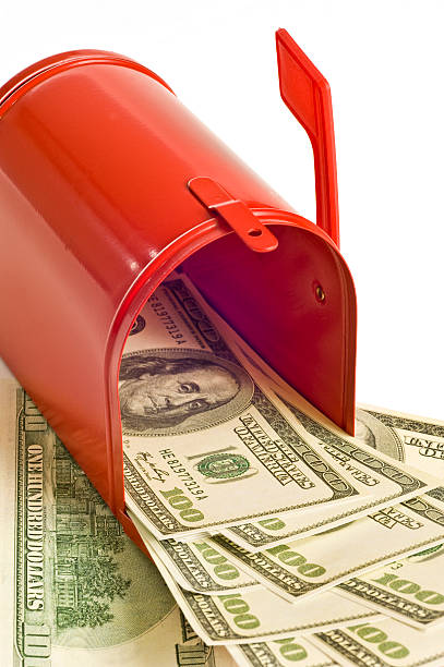 istock Red Mailbox Full of Money 121997138