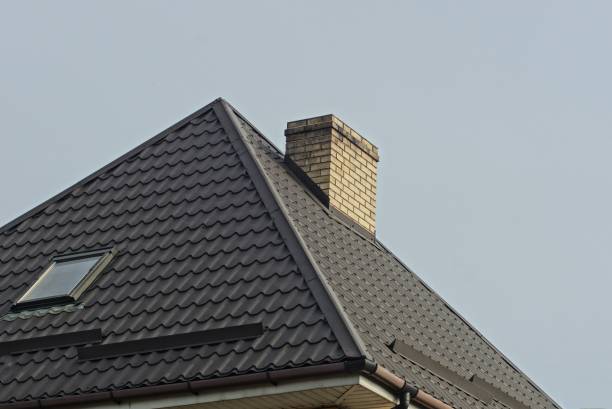 istock brick chimney on a tiled roof with a window 1219972682