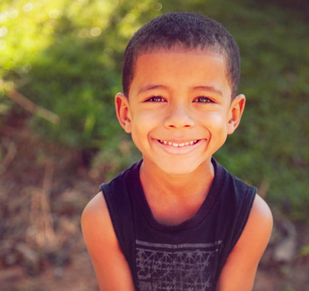 istock Cute little boy smiling outdoors 1219973315