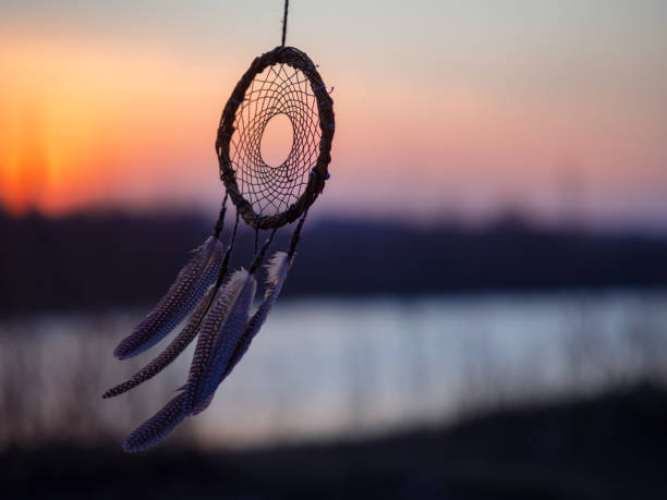 istock Dreamcatcher against a colorful sunset with copy space 1219973337