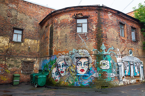 ST. PETERSBURG, RUSSIA - JULY 16, 2016: Graffiti in the poor neighborhood of St. Petersburg, Russia