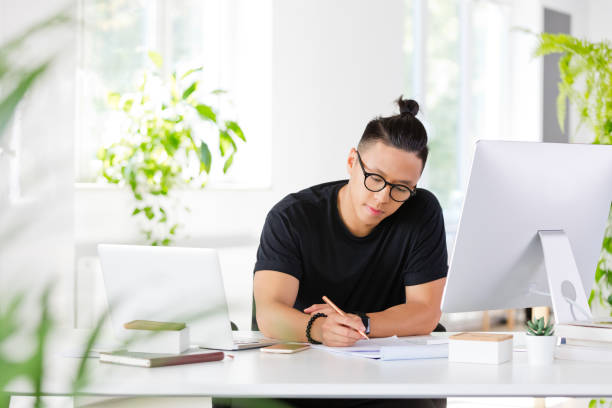 istock Young designer working in the eco-friendly office 1219975621