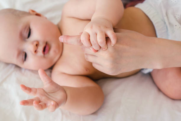istock Naked baby on a light background. 1219977879