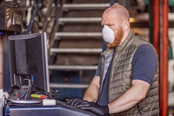 istock A male mechanic essential worker wearing a face mask during virus outbreak 1219979780