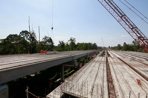 people work on highway overpass construction on countryside of Sao Paulo state, Brazil