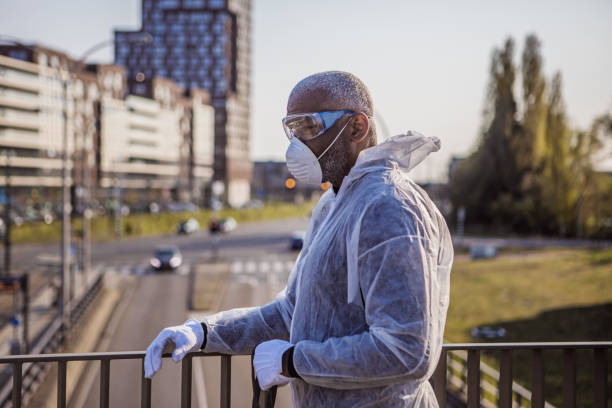 istock A black male essential worker wearing a face mask during virus outbreak 1219980416