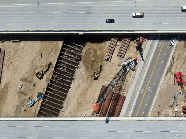 istock Aerial view of highway bridge construction over small river 1219980533