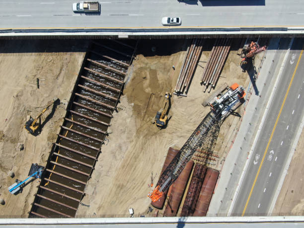 istock Aerial view of highway bridge construction over small river 1219981534