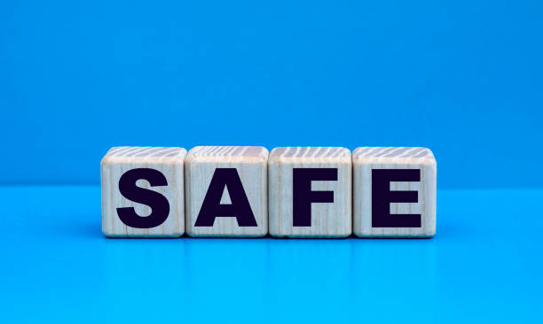 istock concept word SAFE on cubes on a blue background 1219982120