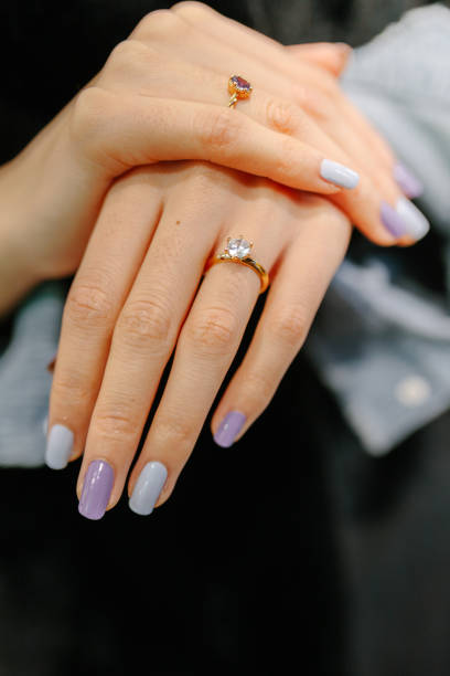 istock Unrecognizable young woman with a diamond ring on her finger for her h 1219982187