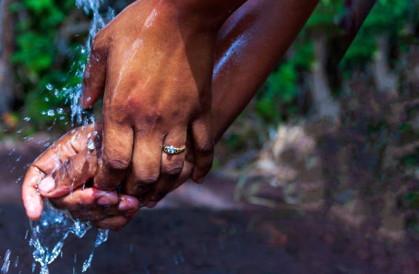 istock Washing hands with running water and soap 1219982264