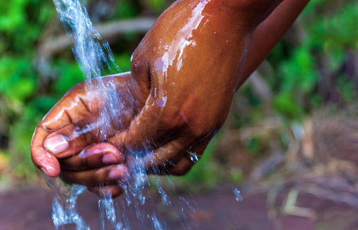 Washing hands with running water and soap. For hygiene and covid-19 prevention concepts.