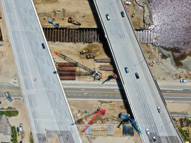 istock Aerial view of highway bridge construction over small river 1219983815