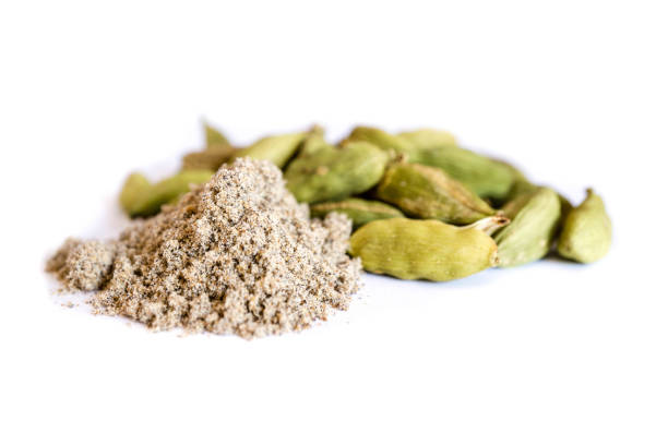 Spice green cardamom powder whole capsules isolated on white background Spice green cardamom powder whole capsules isolated on white background cardamom stock pictures, royalty-free photos & images