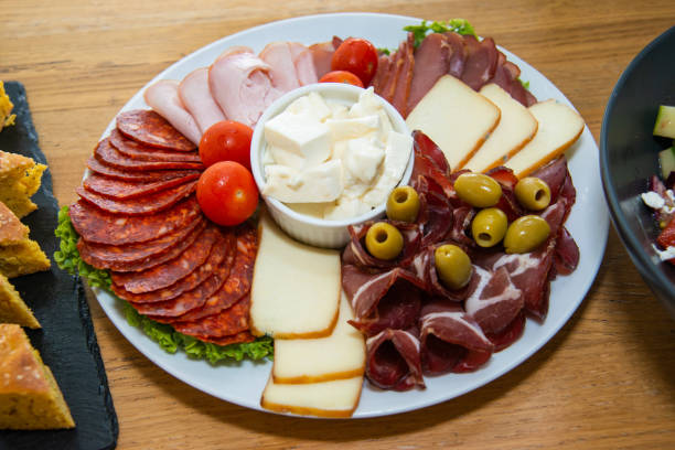 istock Slices of different sausage, ham and salami 1219986300