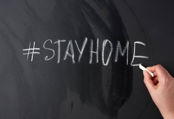 istock inscription stay home in chalk with a hashtag on a black chalk board 1219986436