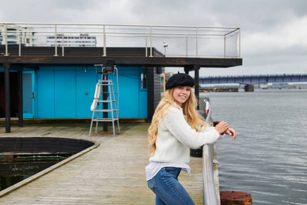 istock Satisfied resting woman on city waterfront 1219986761