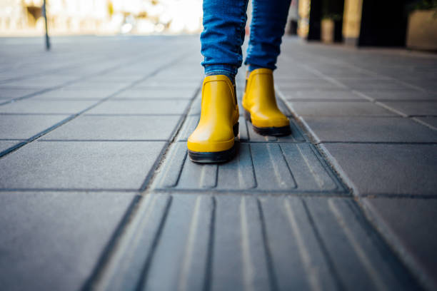 istock Woman standing on blind pedestrian walking 1219986769