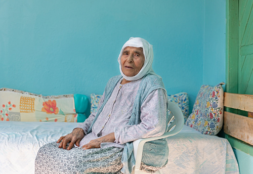 Elder muslim woman portrait at home