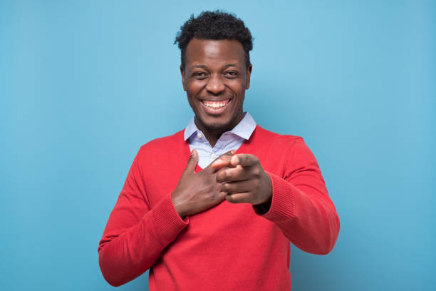 istock Young handsome african american man laughing pointing at you 1219987661
