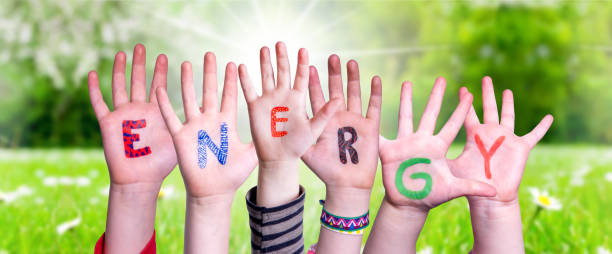 istock Children Hands Building Word Energy, Grass Meadow 1219989847