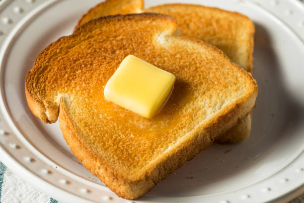 istock Homemade Warm Buttered Toast for Breakfast 1219989872