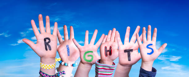 children hands building word rights, blue sky - just kids fotografías e imágenes de stock