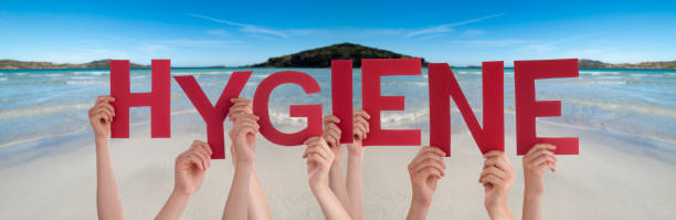 istock People Hands Holding Word Hygiene, Ocean Background 1219990452