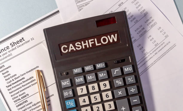CASHFLOW word on calculator and pen on documents CASHFLOW word on calculator and pen on documents cash flow photos stock pictures, royalty-free photos & images