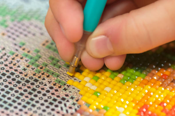 istock Collecting diamond embroidery, diamond mosaic. Creation. CloseUp. 1219993718